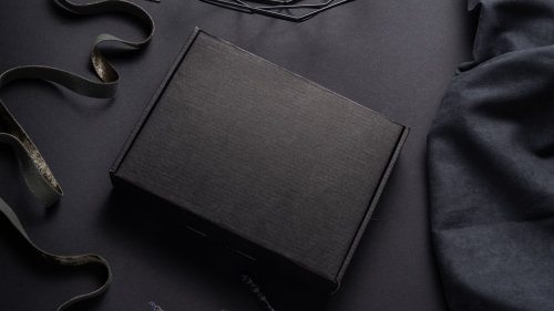 Black cardboard box on dark background