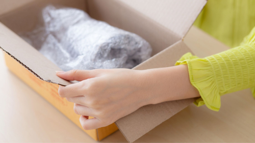 Woman opening a package